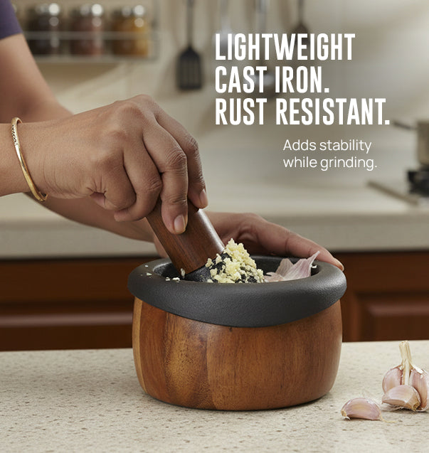 Kroslo cast iron mortar and pestle in use grinding whole spices